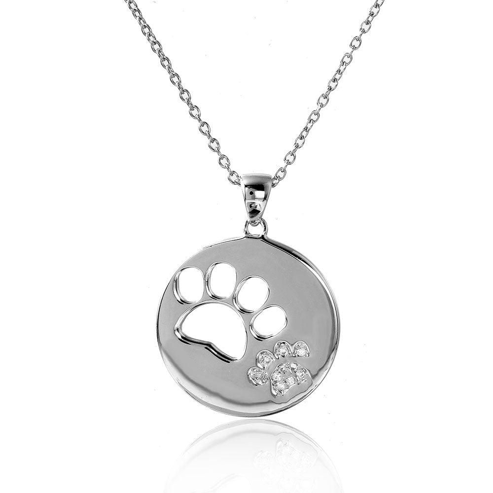 Sterling silver pet paw necklace with a round pendant featuring a cutout paw print and a smaller sparkling paw print accent.