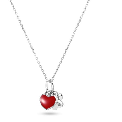 A sterling silver dog paw and heart necklace featuring a vibrant red enamel heart charm next to a sparkling paw print.